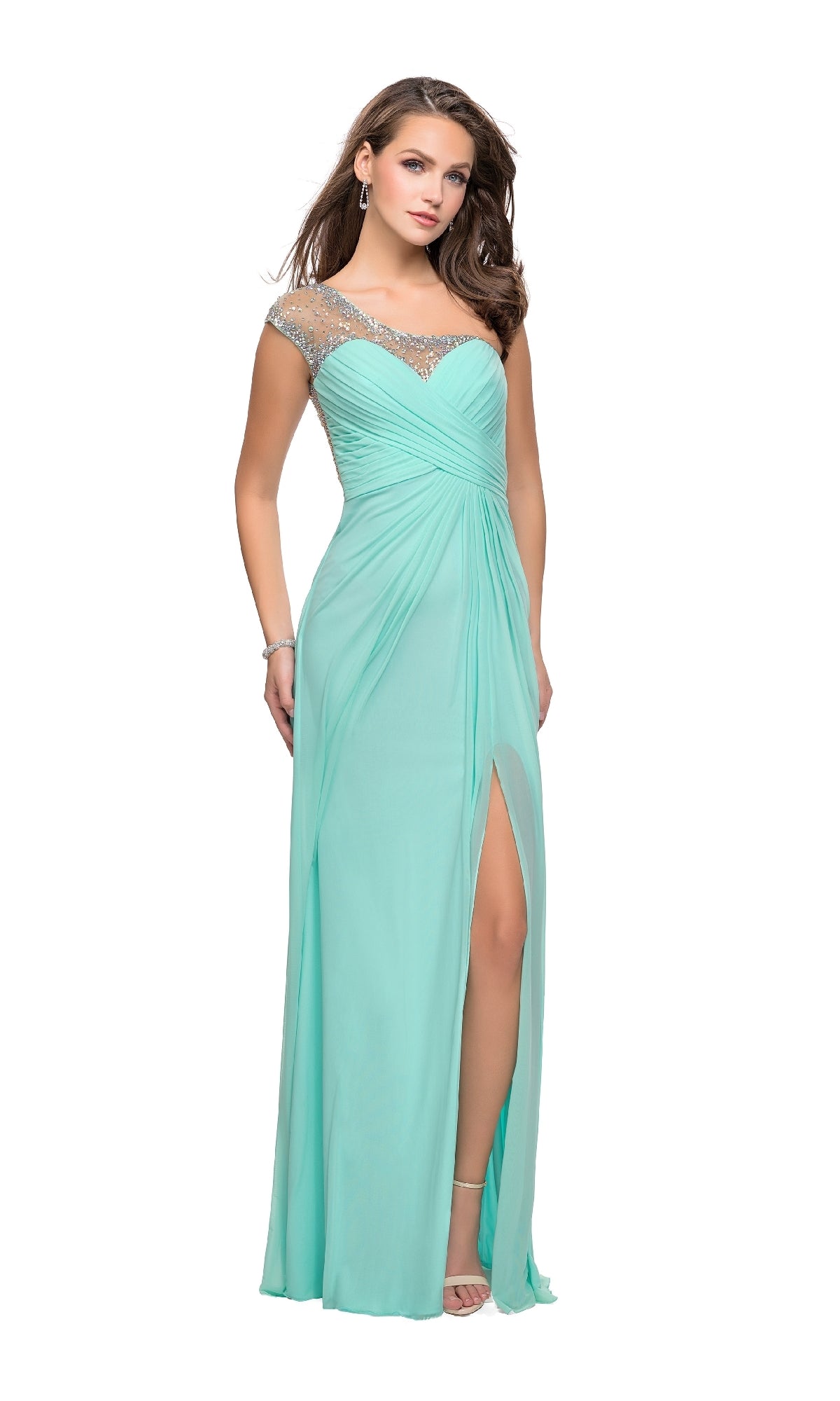 A woman in the La Femme 20384 one-shoulder long prom dress poses against a white background, showcasing its light blue color, sheer embellished neckline, and thigh-high slit.